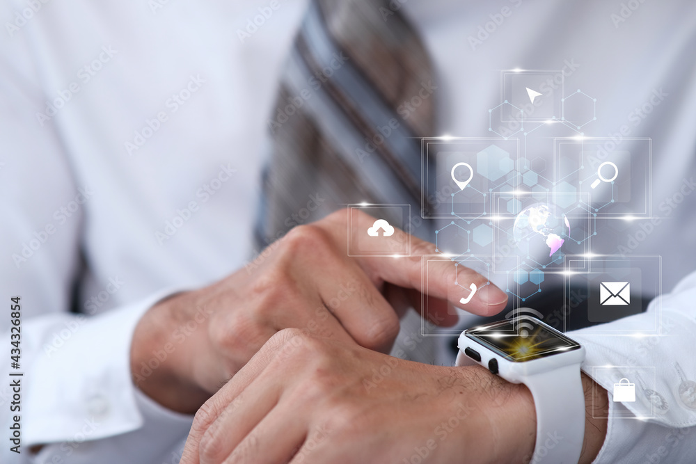 Aufkleber businessman using smartwatch and virtual screen and internet data and technology in the future conce