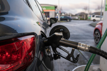 Petrol pump, close-up of a car refueling on a gas station