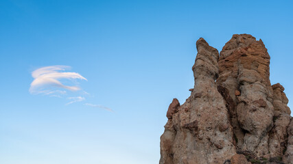 Rock formation with blue sky and clouds
