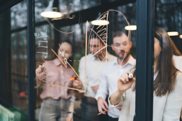 Focused colleagues communicating during meeting in conference room