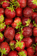 Strawberry red berries background top view