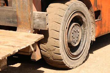 Car - forklift, stacker truck, warehouse forklift. Old car under repair in the garage.