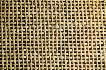 Abstract background from a fibrous fabric with a different color base.