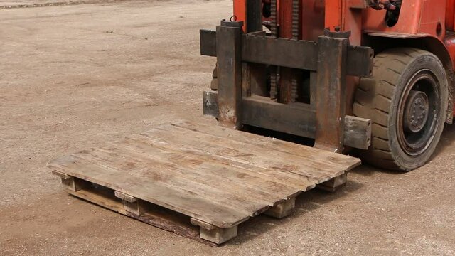 Car - forklift, stacker truck, warehouse forklift. Old car under repair in the garage.