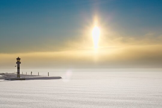 Lighthouse on the frozen lake Storsj&ouml;n during a sunny winter day
