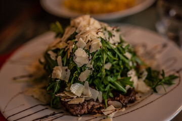 Italian salad with arugula and parmesan 