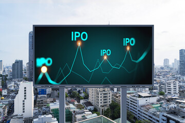 IPO icon hologram on road billboard over day time panorama city view of Bangkok. The hub of initial...