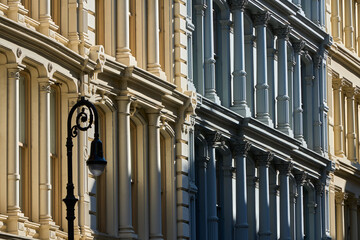 Typical building facades in SoHo, the Cast Iron Historic District with distinct late 19th century architecture. Lower Manhattan, New York City, USA