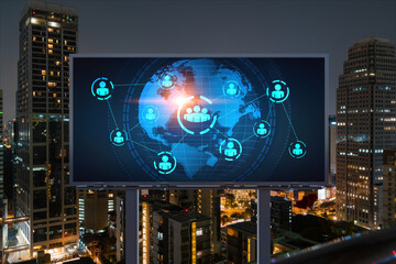 Fototapeta na wymiar World planet Earth map hologram and social media icons on billboard over night panoramic city view of Bangkok, Southeast Asia. Networking and establishing new connections between people. Globe