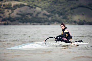 Windsurfer surfing on a windy day at the river.