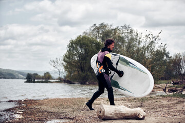 Windsurfer surfing on a windy day at the river.
