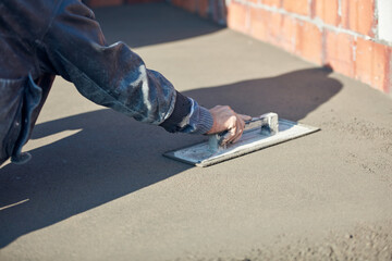 Real construction worker working on a house renovation - authentic person on the job.