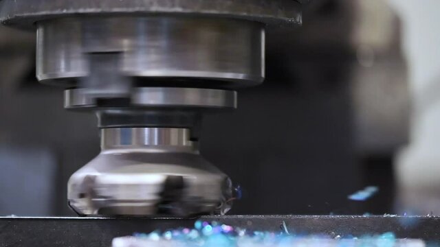 Metalworking. Universal vertical milling machine mills metal in slow motion. High quality FullHD footage