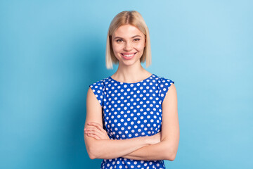 Fototapeta premium Photo of young cheerful girl happy positive smile confident folded hands isolated over blue color background