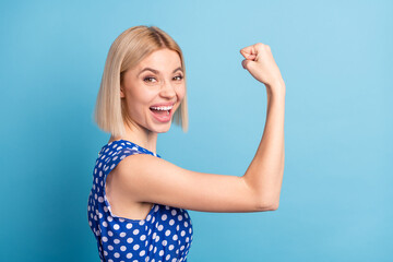 Profile side photo of young cheerful girl happy positive smile show hands muscles biceps strong...