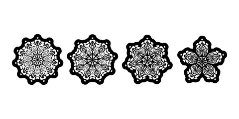 Set of decorative ornaments in the shape of a flower or mandala. Good for logos, prints and postcards. Isolated on white background. Vector illustration