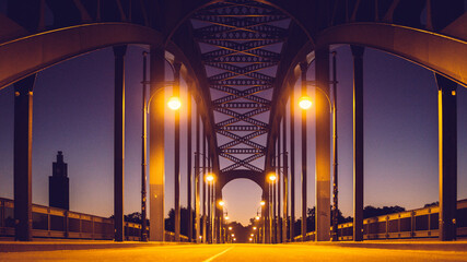 Fototapeta na wymiar Illuminated Bridge At Night