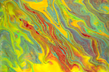 Abstract bright wave marble pattern with golden glitter. Fluorescent artwork liquid paint background.
