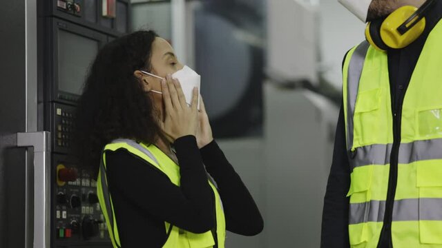 Technician and engineer wearing protective equipment to work in industrial plant To prevent accident from machine. Use mask and face shield. Safety while operating work of worker. Concept care people