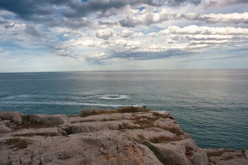 View from the Castle of Peñíscola of the Mediterranean Sea. Nautical sports. Jet skis drawing wakes in the sea