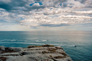 View from the Castle of Peñíscola of the Mediterranean Sea. Nautical sports. Jet skis drawing wakes in the sea