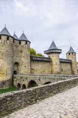 Fototapeta na wymiar Entrance to Chateau Comtal in the walled and turreted fortress of Carcassonne La Cite. Carcassonne, Languedoc, region of Occitanie, France.
