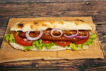 Sausages with salad served in bread