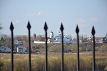 forged iron fence on the background of the monastery
