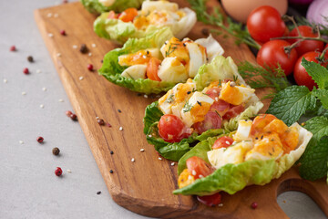 Diet menu. Healthy salad of fresh vegetables - tomatoes, egg, Onion. high angle view of a nutritious vegetable salad with boiled egg slices, served.  Healthy meal concept.