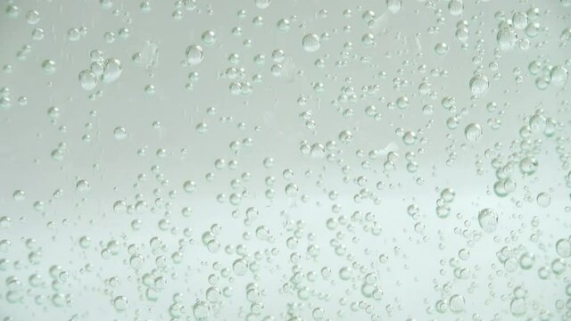 Air bubbles of the fizzy water.
