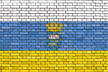 flag of Nunoa, Chile painted on brick wall