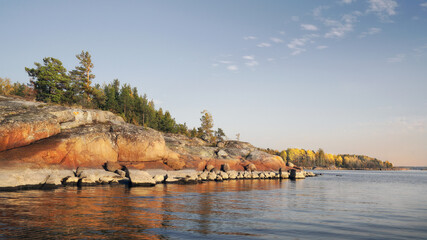 granite rocks with woods are coastline and islands in North Europe, Baltic sea, gulf of Finland. Clean nordic nature in autumn