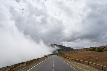 Road covered in cloud on the top of the mountain