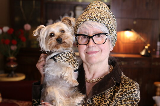 Posh Senior Woman With Vintage Leopard Print Look Matching Her Dog