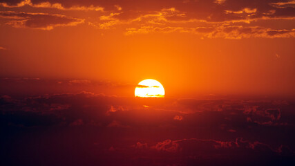 Sunset over the hills in clear weather gorizon clouds
