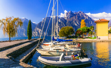 idyllic nature scenery.  Beautiful lake  Lago di Grada. Torbole village with sailing boats . Italy,...
