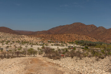 Landscape on the Kunene River with Himba village, Namibia