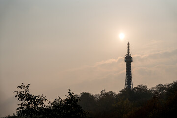 The sun rises over the Tower in Prague