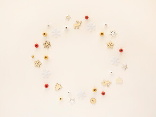 Christmas card with red, silver and golden decorations over white background. Flat lay, top view, copy space. Christmas Circle shaped border