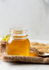 Honey jar with spoon. Autumn harvest.