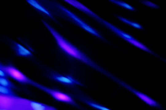 Blur colorful neon light leaks on black background. Defocused illuminated abstract futuristic texture for using over photos as overlay or screen filter - Powered by Adobe