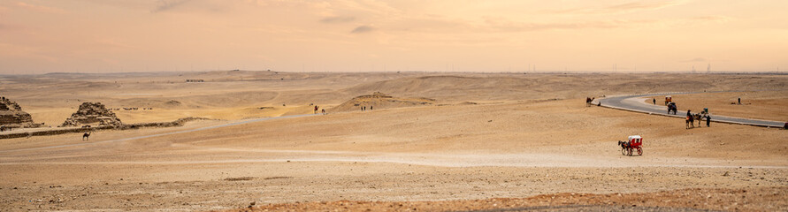 Fototapeta na wymiar Panoramic Shot egyptian desert. Egyptian desert in Giza. Landscape in Egypt. Pyramid in desert. Africa. Wonder of the World. Copy space
