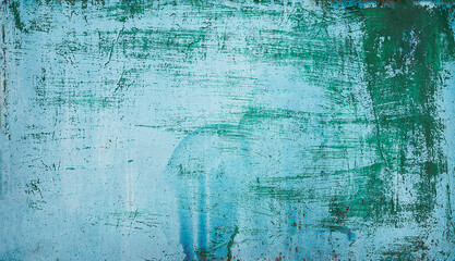 Old grungy cracked distressed weathered wall paint peeling off rusted metal sheet. background for posters and bloggers