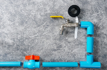 Blue PVC pipe with faucet and water valve with copy space.	