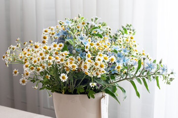 Fototapeta na wymiar Colorful wildflowers in a vase