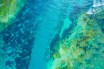 Aerial view to ocean waves. Blue water background. Dramatic colors photo.
