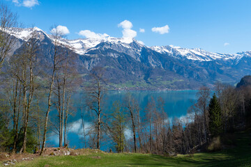 Beautiful view over lake Brienzersee and snow covered mountains