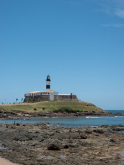 Lighthouse museum and the beach - vertical