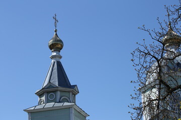 cross on the church dome against the sky