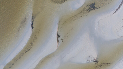 Aerial top down view to the patterns of the coastal  natural sandbar formations